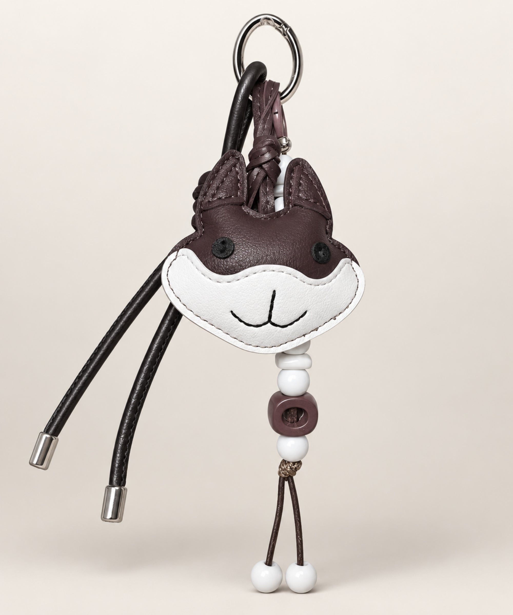 Dark brown rabbit PU leather-look bag charm keychain with beads and cord details
